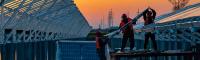 men installing solar panels in China