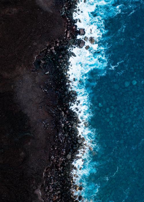 Intersection of the ocean and soil farming land.